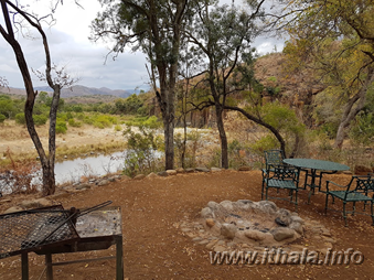 Outdoor seating area overlooking the river at Thalu Bush Camp